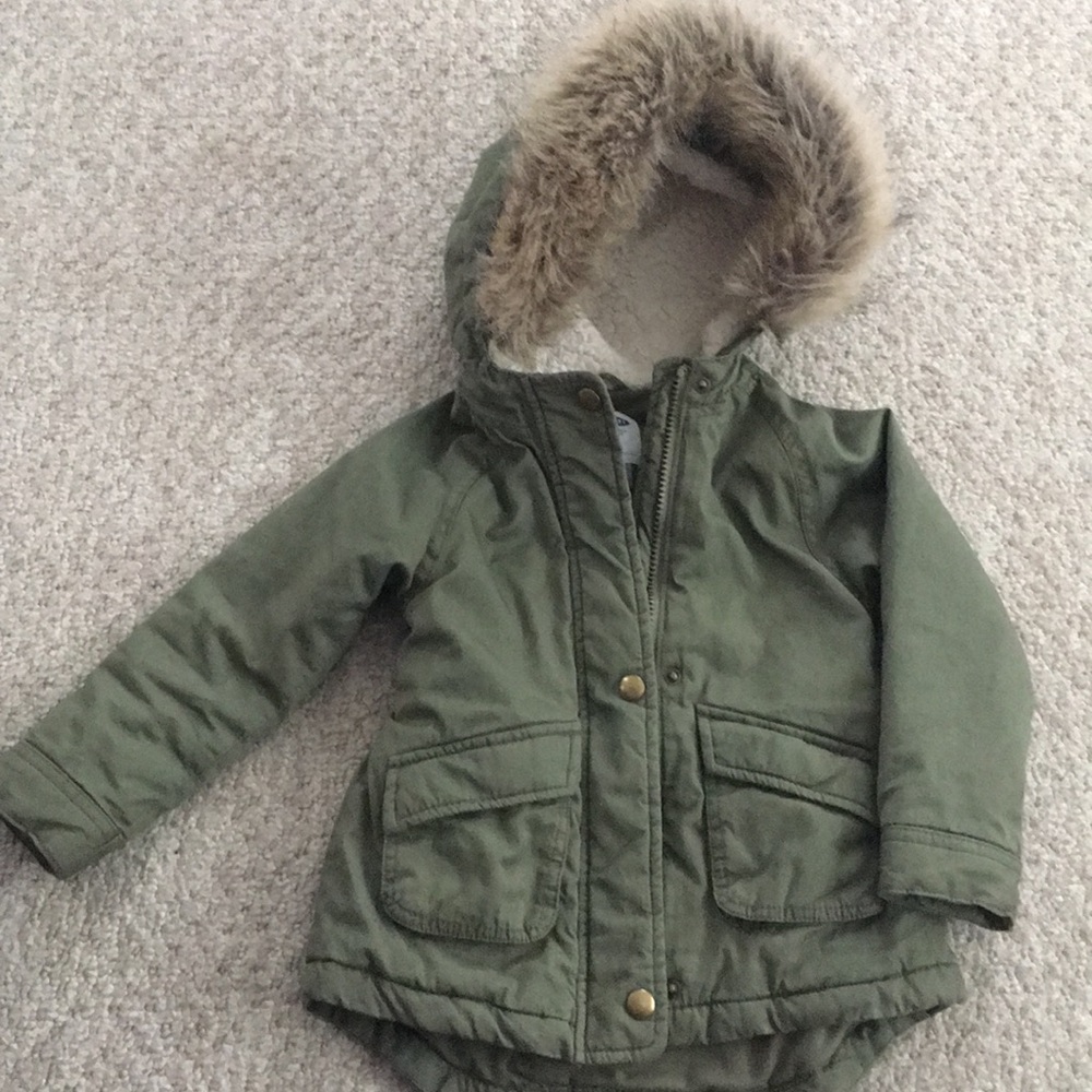 Green parka with faux fur hood.